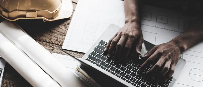 contractor using adaptive construction solution on a laptop